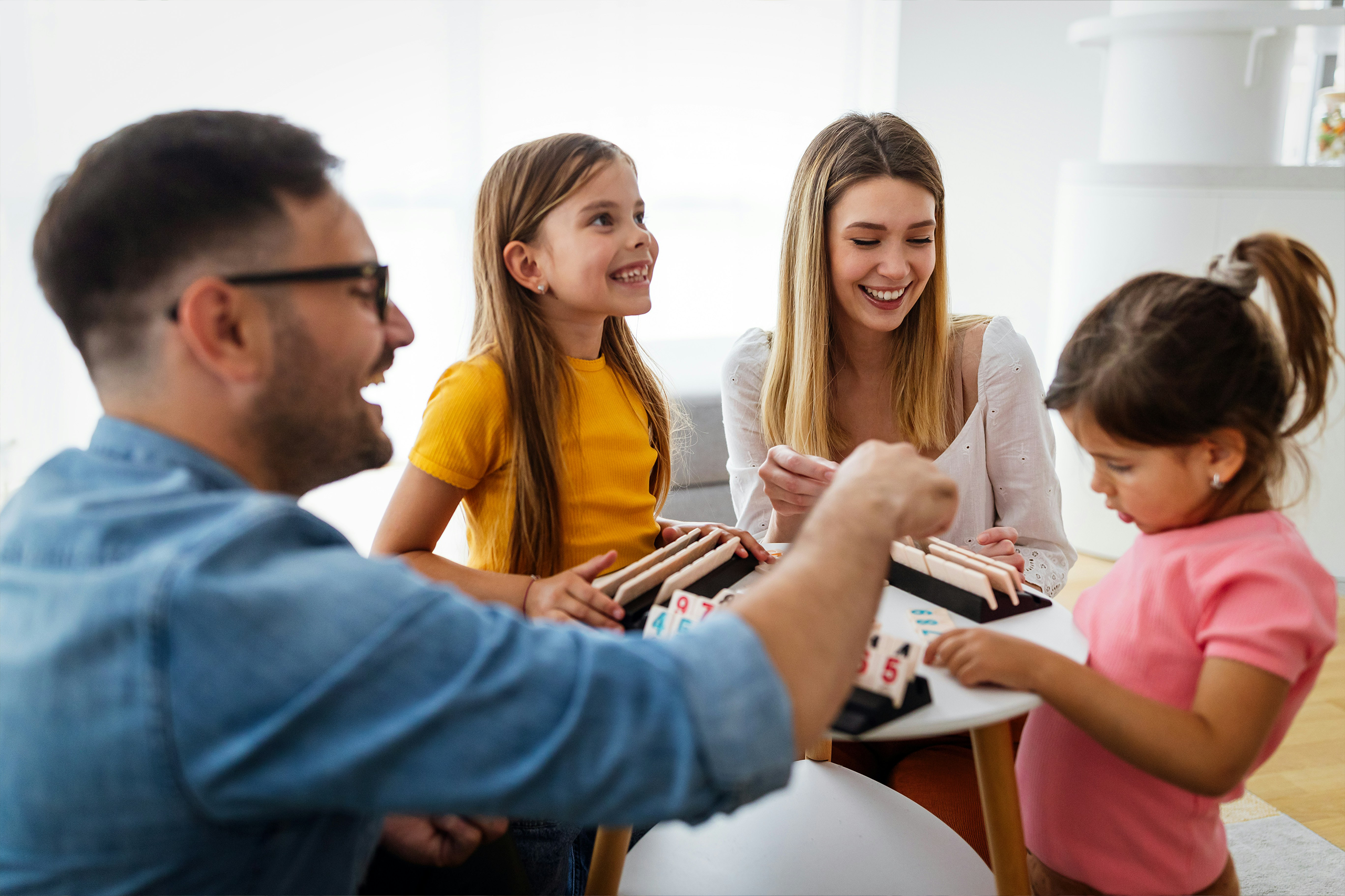 aba-support-home-school-community Child receiving support from adults in different settings—home, classroom, and playground—illustrating ABA across environments